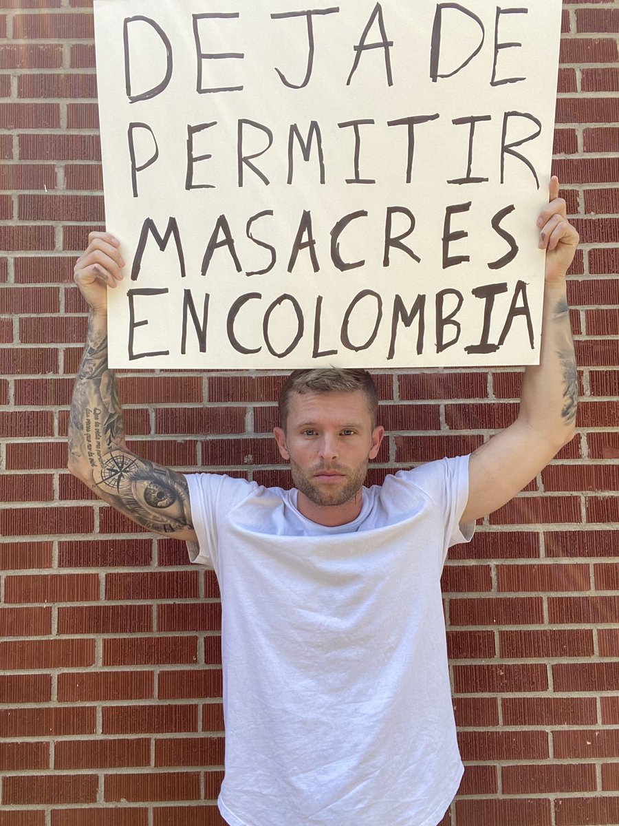 Slacktivism: Zach Morris post a photo holding a sign that says “Stop permitting massacres in Colombia. 