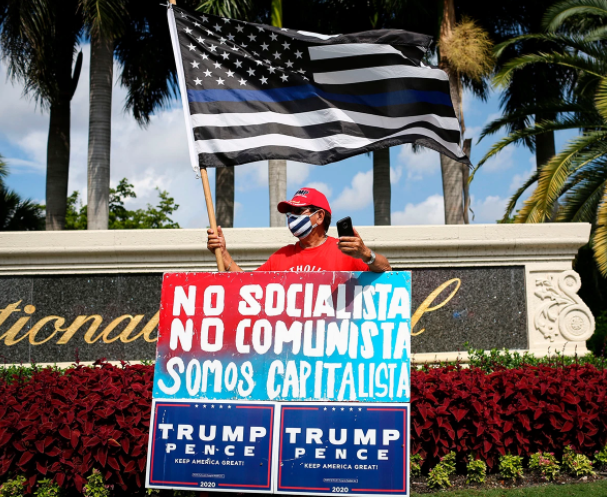 A supporter of US President Donald Trump rallies outside a Latinos for Trump event in Doral, Florida.
